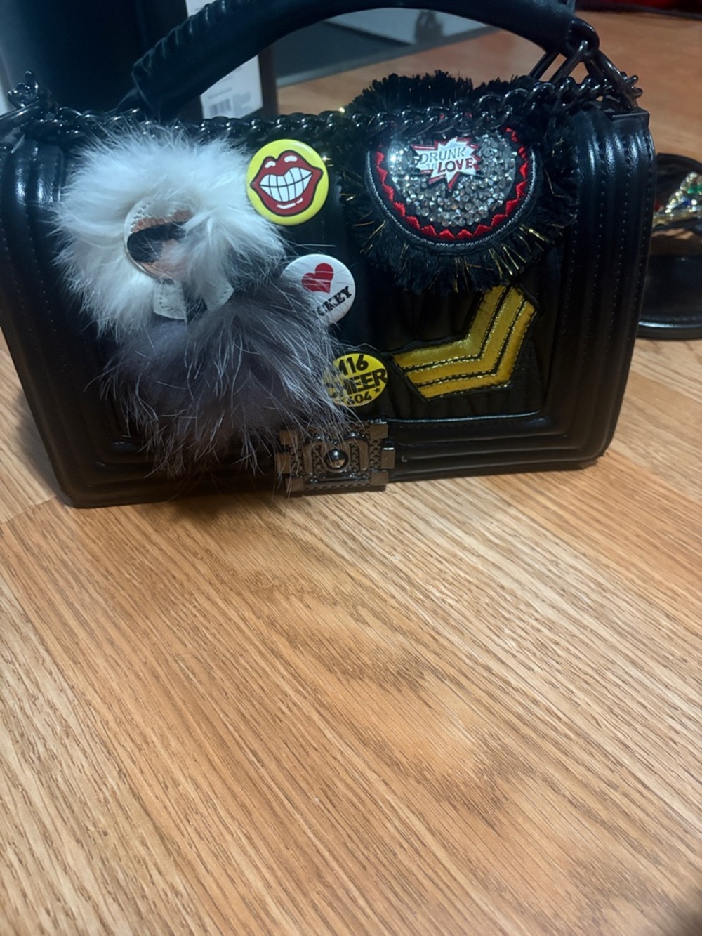 Black Embellished Mini Handbag with Patches and Fur Charm